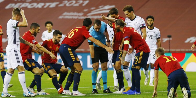 Soccer Football - UEFA Nations League - Group D - Spain v Germany - Estadio La Cartuja, Seville, Spain - November 17, 2020  Spain's Sergio Ramos and Rodri remonstrate with the referee REUTERS/Marcelo Del Pozo